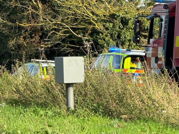 Police and a search and rescue team in a layby in Bramford