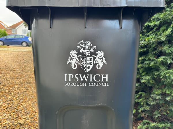 A black bin with the Ipswich Borough Council logo