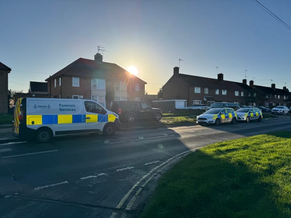 Two police cars and a forensics unit at an address on Hawthorn Drive, Ipswich