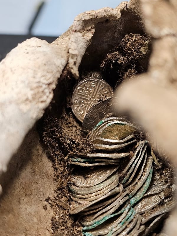 11th century silver coins wrapped in cloth and lead in a bundle