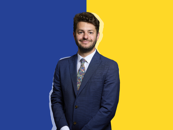 Jack Abbott, MP for Ipswich, on a half blue and half yellow background