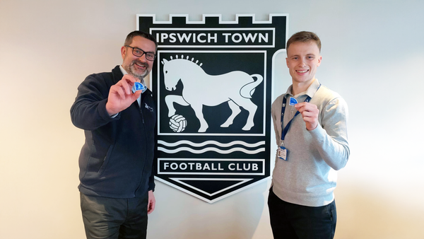 Jon Neal with Seb Norton, Supporter Engagement Executive at ITFC with the new "In Your Corner" badges