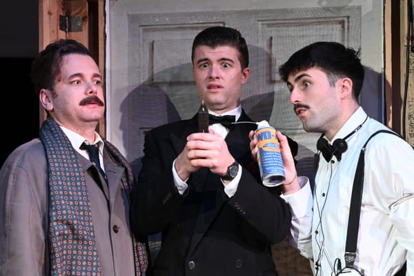 Cast members performing in Dial M for Mayhem