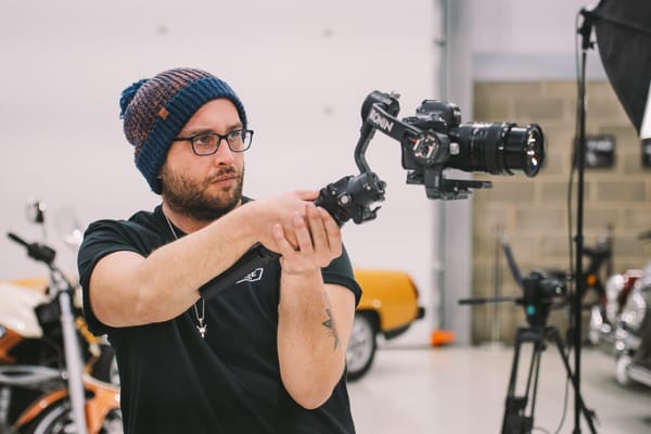 Nick Skinner filming at the Bridge Classic Cars garage