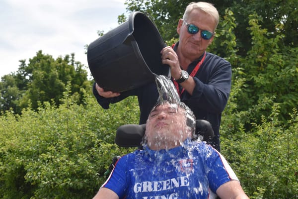 Peter Over, an ITFC ambassador, 'helps' out Harrison Mayhew-Kemp in the ice bucket challenge