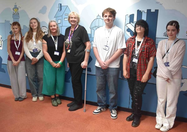Students and staff from Suffolk New College with at the mural launch