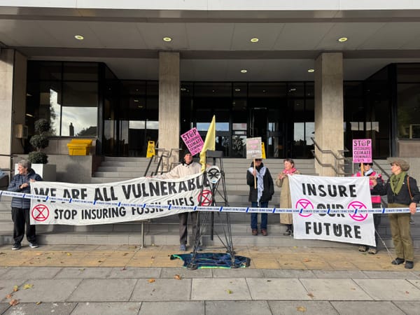 Extinction Rebellion activists outside AXA's offices on Civic Drive, Ipswich