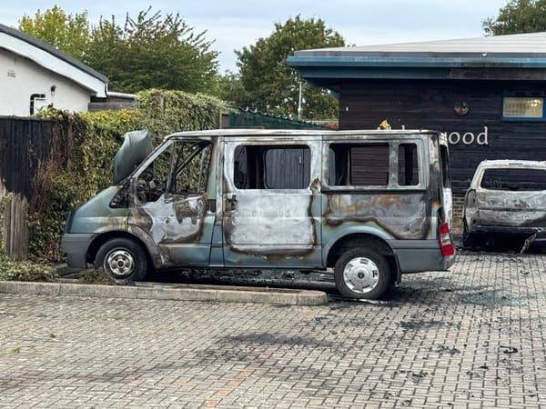 A burnt out van in the car park at Piper’s Vale Academy