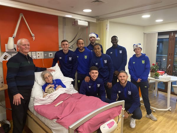 Charlie and Wendy with Blues players