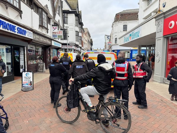 Shoppers looked on as police arrested a man on Tavern Street